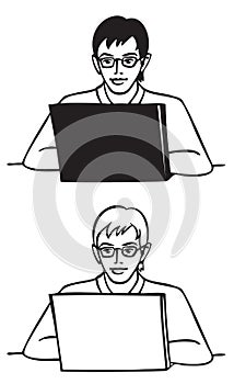 Young man with glasses behind laptop