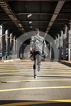 A young man goes running in the cold weather of Brooklyn, NYC