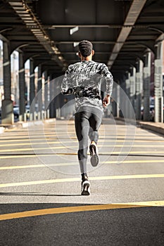 A young man goes running in the cold weather of Brooklyn, NYC