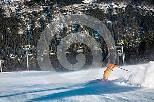 Young man going quickly down the slope