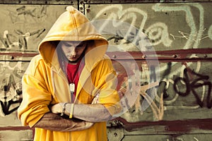 Young man on graffiti grunge wall