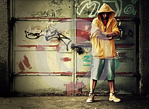 Young man on graffiti grunge wall