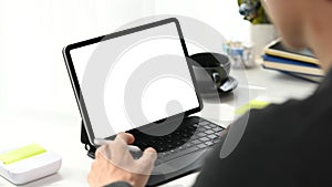 Graphic designer working with tablet computer at creative workplace.