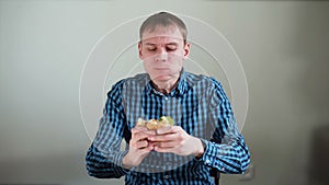 Young Man Greedily Eating the Sandwich