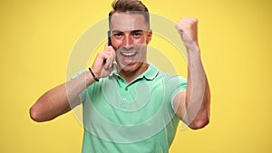 young man in green polo shirt in studio