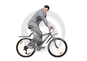 Young man in grey business suit on bike