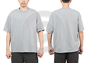 Young man in grey oversize t-shirt mockup front and back used as design template, isolated on white background with clipping path