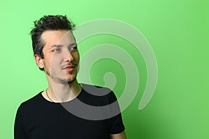 Young man or guy on a light green background. The emotion of calm and serenity