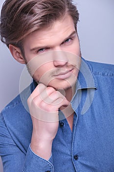 young man with hand on his chin