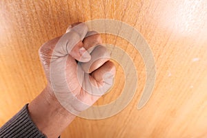 young man hand knocking door,