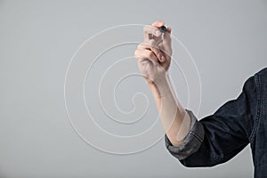 Young man hand with pen