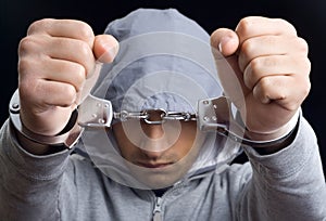 Young man handcuffed