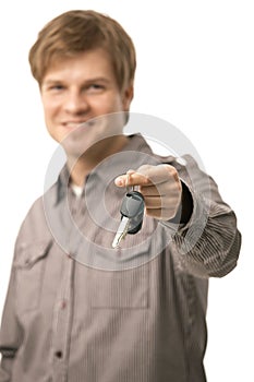 Young man handing over ignition keys