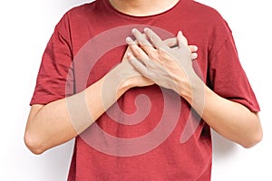young man hands holds his left chest, chest pain concept from Myocarditis or pericarditis caused by immune system,bacteria or vir photo