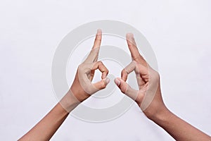 Two man's hand gestured funny eye showing symbol photo