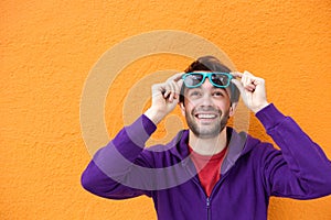 Young man with happy expression on face looking up