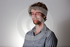 Young man happy smile on gray background