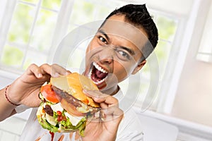 Young Man have a great desire to eat a burger