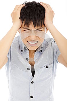 Young man have a headache and feel very painful