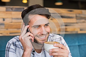 Young man having cup of coffee