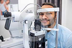 Young man having an examination in a ophtalmological clinic