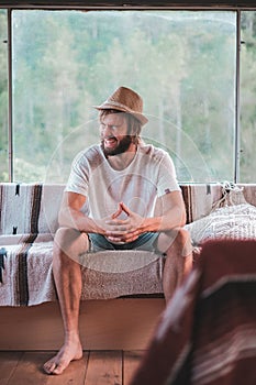 Young man having fun inside a mobile home