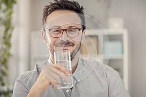 Young man having glass of water