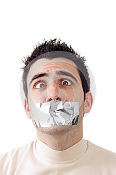 Young man having gray duct tape on his mouth