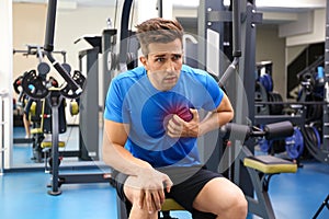Young man having heart attack