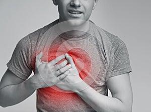 Young man having heart attack. healthcare concept