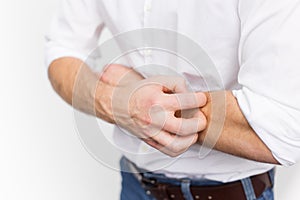 Young man having itchy and dry skin problem