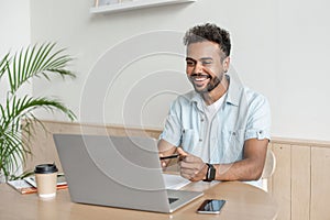 Young man having meeting online, Student men using laptop computer at home.