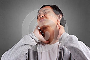 Young Man Having a Neck Pain