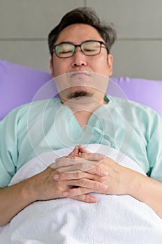 Young man having a restful sleep in a hospital bed