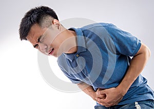 Young man having a stomachache