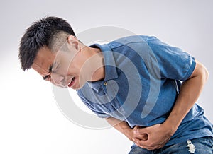Young man having a stomachache