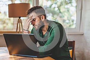 Young man having stressful time working