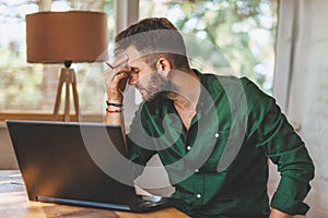 Young man having stressful time working