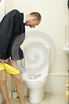 Young man having toilet issues