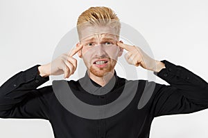 Young man headache. Redheaded guy with red beard in thinking process isolated. Close up of male face. Mental and mind working.