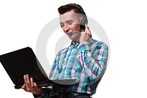 Young Man with Headset Holding Laptop - Call center man with headset and laptop computer on white background