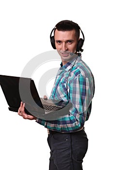 Young Man with Headset Holding Laptop - Call center man with headset and laptop computer on white background