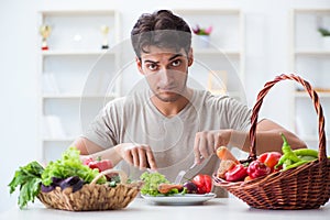 The young man in healthy eating and dieting concept