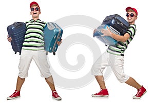 The young man with heavy suitcases isolated on white