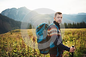 Young man hiking alone in the wilderness