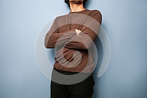 Young man with his arms crossed