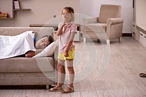 Young man with his daughter at home