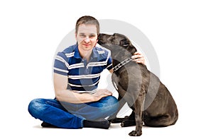 Young man and his licking dog