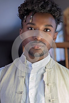 Young man in his twenties african guy portrait confident handsome looking