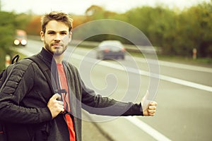 Young man hitchhiking